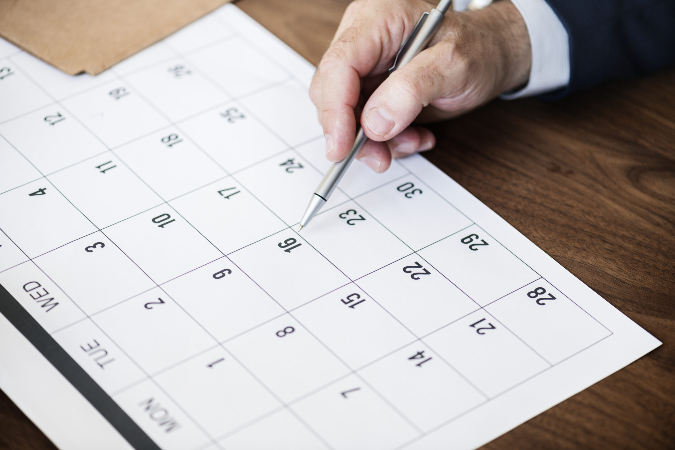 businessman-marking-calendar-appointment-scaled.jpg