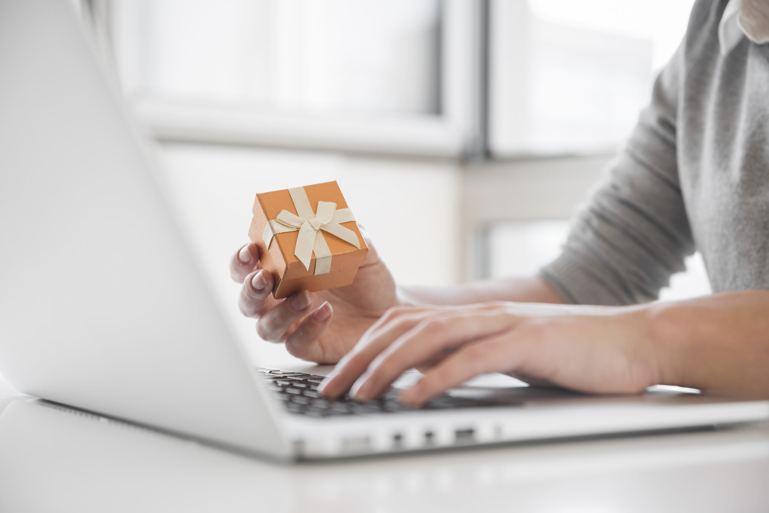 woman-sitting-table-with-laptop-scaled.jpg